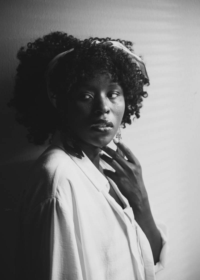 The artist in a white shirt, black and white portrait